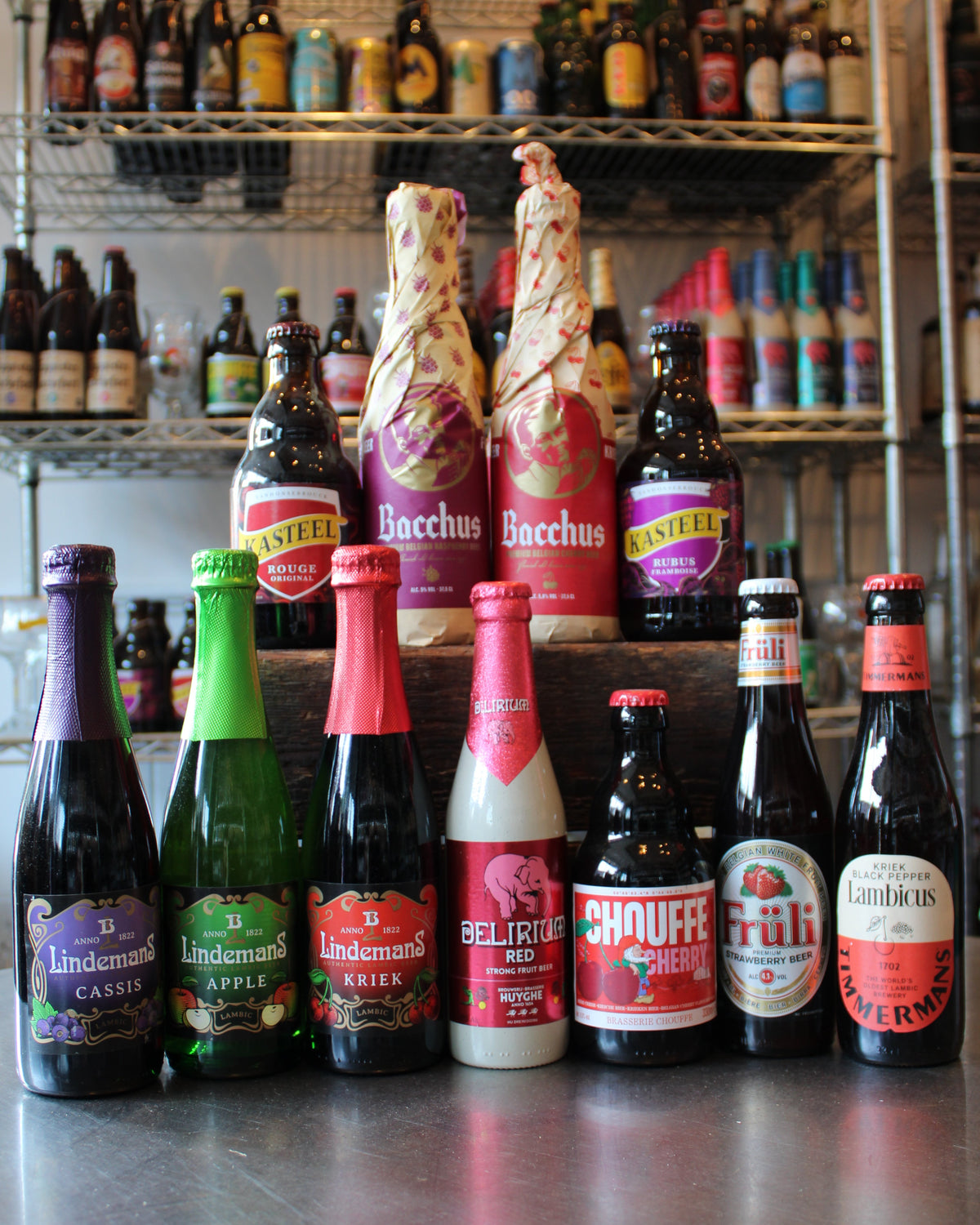 Display of Belgian fruit beer and lambic bottles